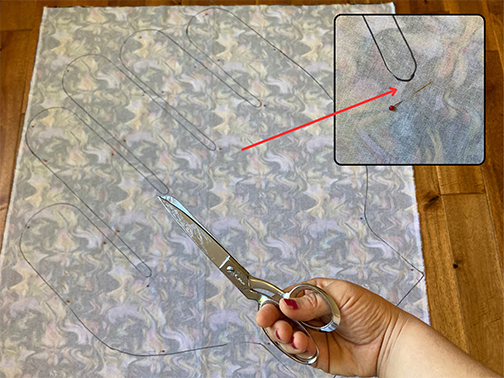 Use sharp fabric shears to cut out the hand shape from your folded fabric of choice. 