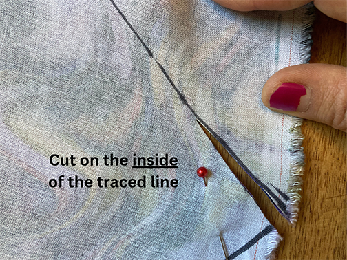 Cut on the inside of the line that you traced of the hand pattern