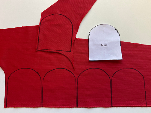 Use the nail sewing pattern to trace five nails on the wrong side of the red velvet