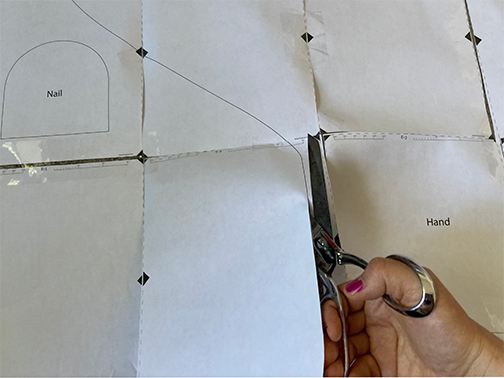 cut out the paper sewing patter that you printed from the downloadable sewing pattern